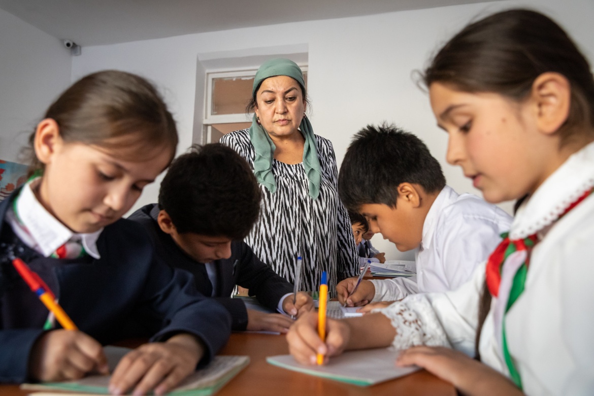 Grade 4 students do group work under the watchful eye of their teacher, Boboeva Kurbonbi, at school 51 in the town of Kulob, Khatlon Region, Tajikistan. Credit: GPE/Kelley Lynch