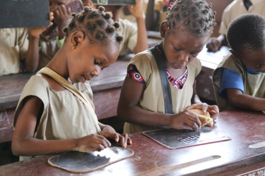 Children write on their slates at the So Ava Primary School in Benin. Credit: GPE / Chantal Rigaud Children write on their slates at the So Ava Primary School in Benin. Credit: GPE / Chantal Rigaud