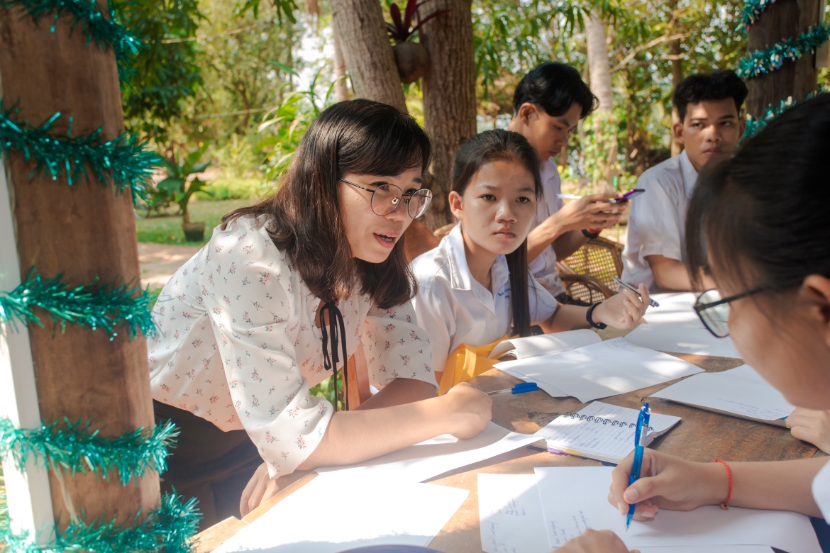 Chan Bopha, Head of HR at DHL Cambodia Express, trains and supports high school students from Kandal province to write their first CV. Credit: DHL Express Cambodia