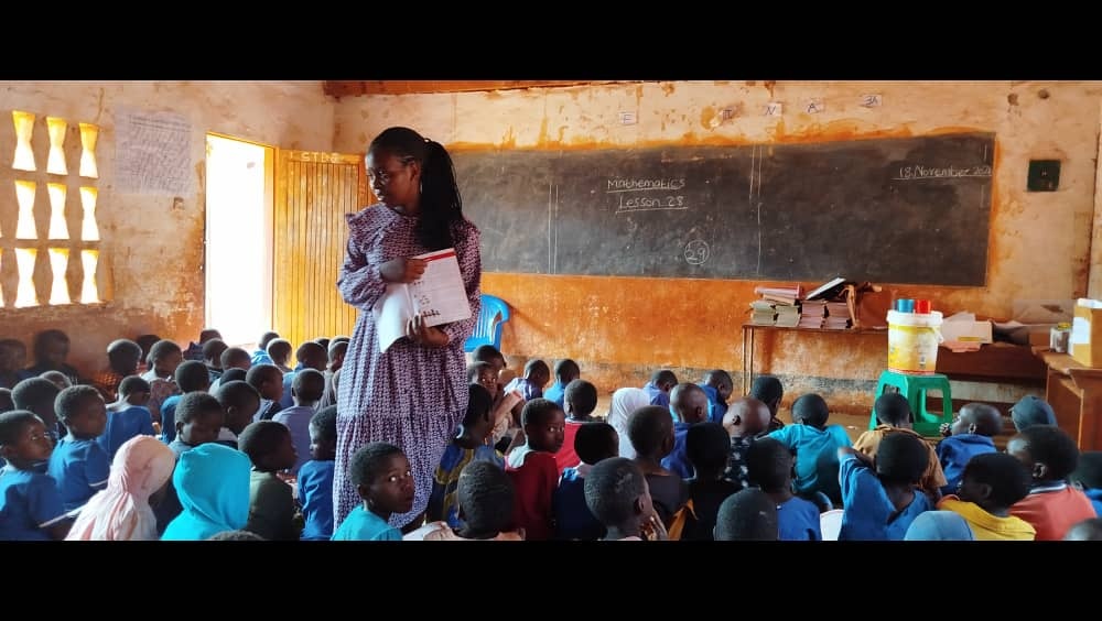 Students and their teacher in class at Yepa Primary School, Dzenza Zone, Lilongwe, Malawi. Credit: Cambridge Education
